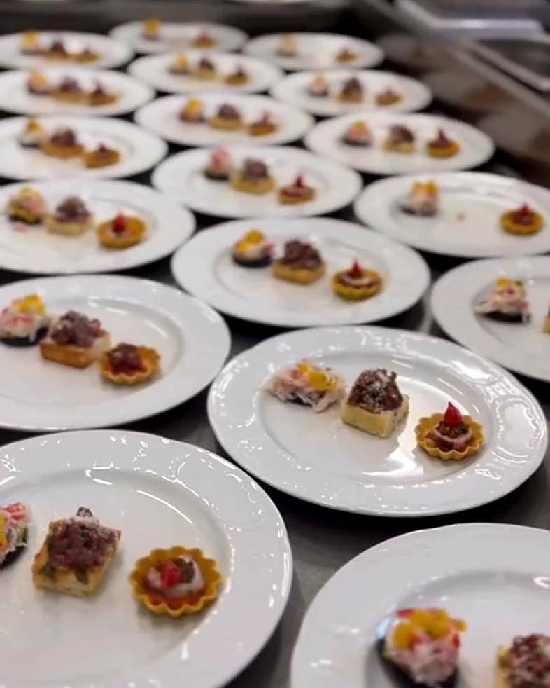 Rows of plates with canapés ready for service